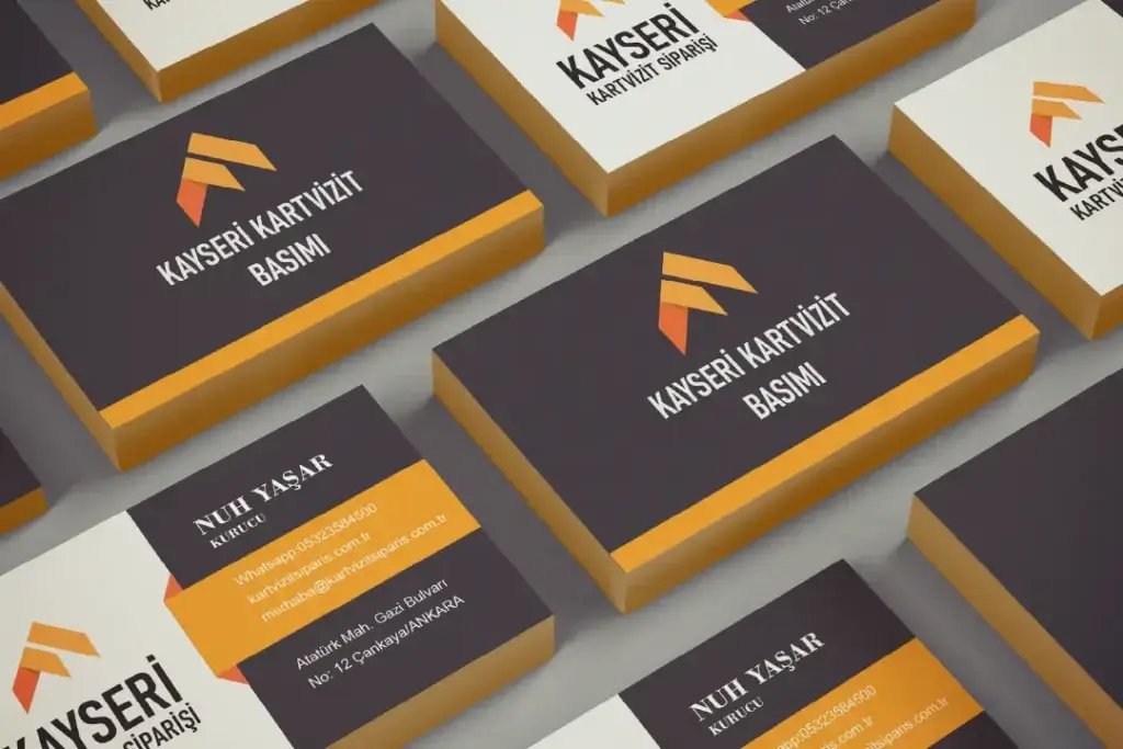 Kayseri'de modern tasarımlı kartvizit örnekleri – siyah zemin üzerinde turuncu ve beyaz detaylarla profesyonel baskı