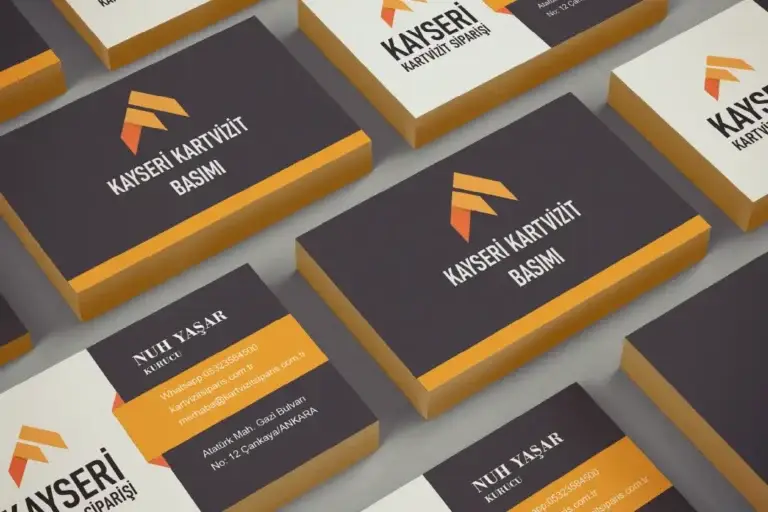 Kayseri'de modern tasarımlı kartvizit örnekleri – siyah zemin üzerinde turuncu ve beyaz detaylarla profesyonel baskı